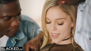 A blonde in an intense scene with multiple black partners, featuring the stunning Kali Roses