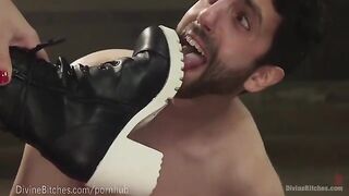 The strong dominatrix wrestles with her slave boy and takes control