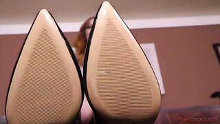 A sexy mistress punishes her employee in a steamy office scene