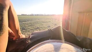 A couple has fun in the camper van on a sunny day with open door