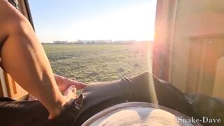 A couple has fun in the camper van on a sunny day with open door