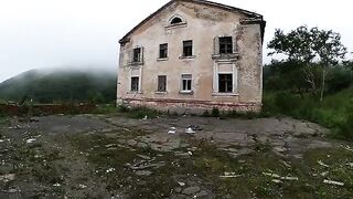 Girl is walking around horrible buildings, cock getting sucked in an abandoned house