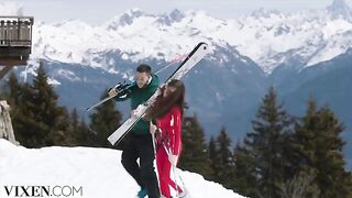 A young skier is having fun on the slopes with a companion