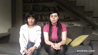 Two hot lesbians are having fun with a strapon dildo