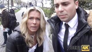 A blonde is having sex with a collector in front of her new husband