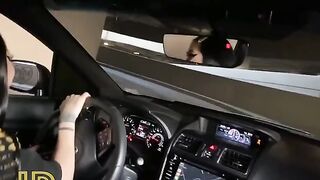 Slutty chick sucks cock in the car parked in the parking lot