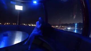 A couple has a romantic date in the park, getting intimate under the stars