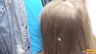 A petite girl was nearly caught while giving a blowjob in a shop changing room