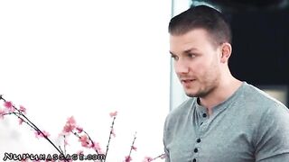 Two masseuses serve one client in a steamy Nuru Massage scene