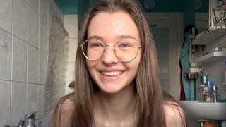 The cute teen squirts while being penetrated by a huge dick in the kitchen