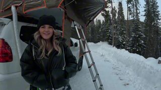 A girl is having fun with a stranger in the tent while camping