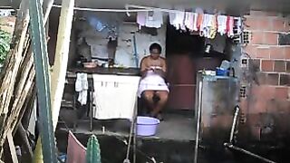 A girl does not know that there is a camera in her room