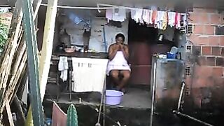 A girl does not know that there is a camera in her room