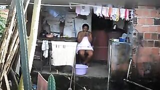 A girl does not know that there is a camera in her room