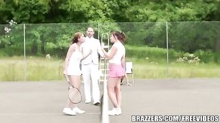 A girl has fun with her friend on the tennis court with her rich uncle