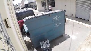 A naked chick is having sex behind the garbage tank