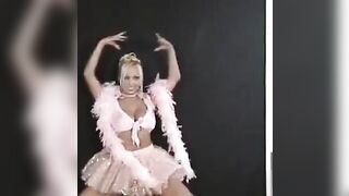 A charming Russian woman is dancing and showing her body to all