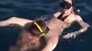 Two aqua sex workers have sex right in the water