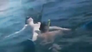 Two aqua sex workers have sex right in the water