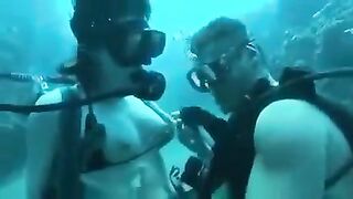 Two aqua sex workers have sex right in the water