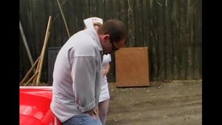A nurse is having fun with a guy directly in the car