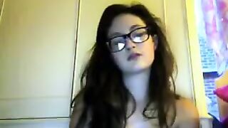 A girl with glasses has sex on webcam with a guy