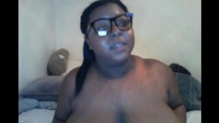 A black woman with big natural boobs closed the camera