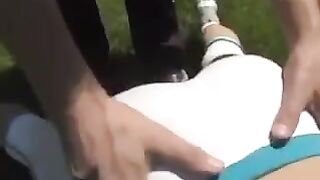 A cum shot on the chest of a busty brunette woman