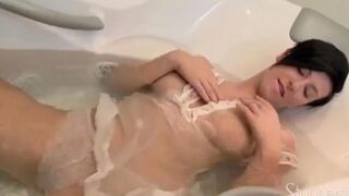 A lonely pregnant brunette masturbates on the couch