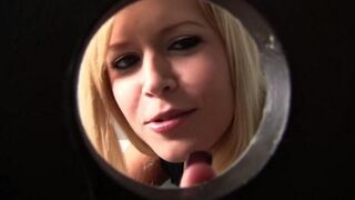 A sexy blonde girl sucks a guy's cock through a hole in the toilet