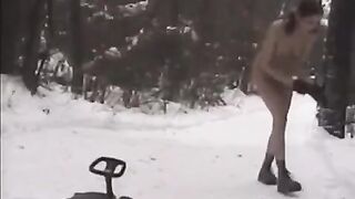 Naked beauties have fun with snowballs on the streets of the city in winter