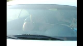 A cute girl shows her shaved pussy on the bonnet and spreads it