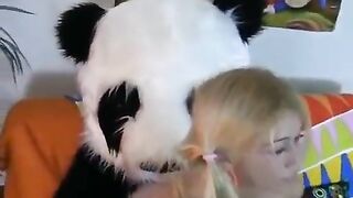 A woman has sex with a guy in a panda suit