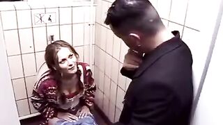Two young people are fucking on the toilet in the club