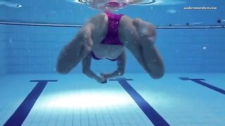 Nude beauty has fun in the pool, showcasing her carefree moment