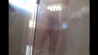 A guy washes himself in the shower, but there’s a camera watching