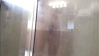 A guy washes himself in the shower, but there’s a camera watching