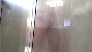 A guy washes himself in the shower, but there’s a camera watching