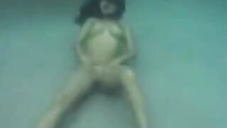 Sex on the ocean floor with a busty brunette can be a lot of fun
