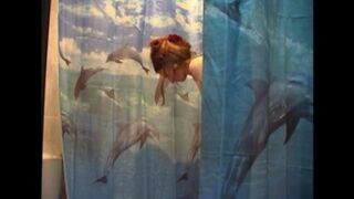 A man secretly films his naked wife in the bathroom