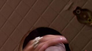 A cute beauty got a dick in her mouth through the toilet hole