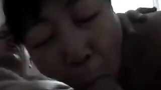 The Chinese woman practices her blowjob skills on him