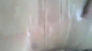 Putting a condom on the dick and jerking it by hand