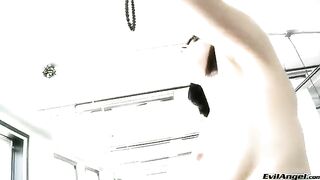 A sexy brunette in high heels masturbates with a dildo, screaming