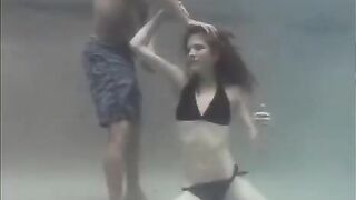 A sexual lady has sex with a guy right in the swimming pool