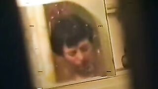 A drunken woman was fucked in the bath by a soldier, her skin glistening