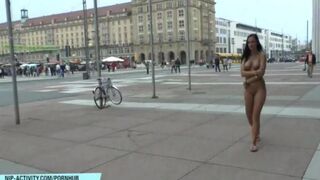 A hot girl is walking naked on the city streets
