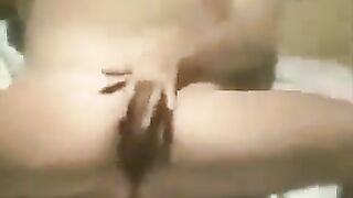 A girl caresses herself on the coast and was noticed by a camera