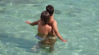 Girl fingers a guy’s cock while they are underwater in the sea