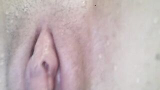 A pussy of a sexy girl is shown in close-up view underwater
